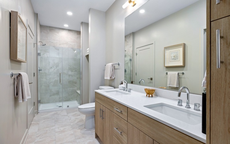 a spacious bathroom with a dual vanity