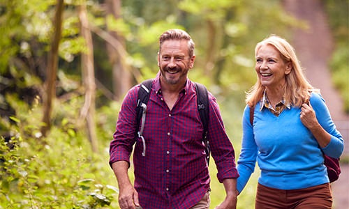 couple walking in the forest 